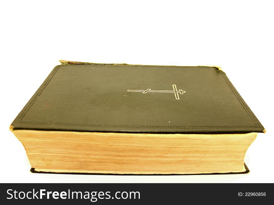 An Old Bible On A White Background