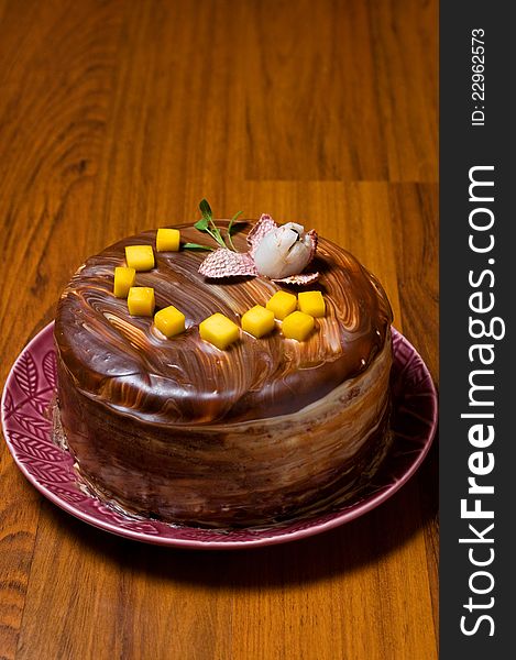 Chocolate layer cake on a wooden surface