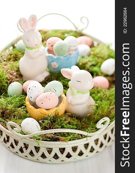 Easter decoration with bunny and chocolate eggs on moss. Easter decoration with bunny and chocolate eggs on moss