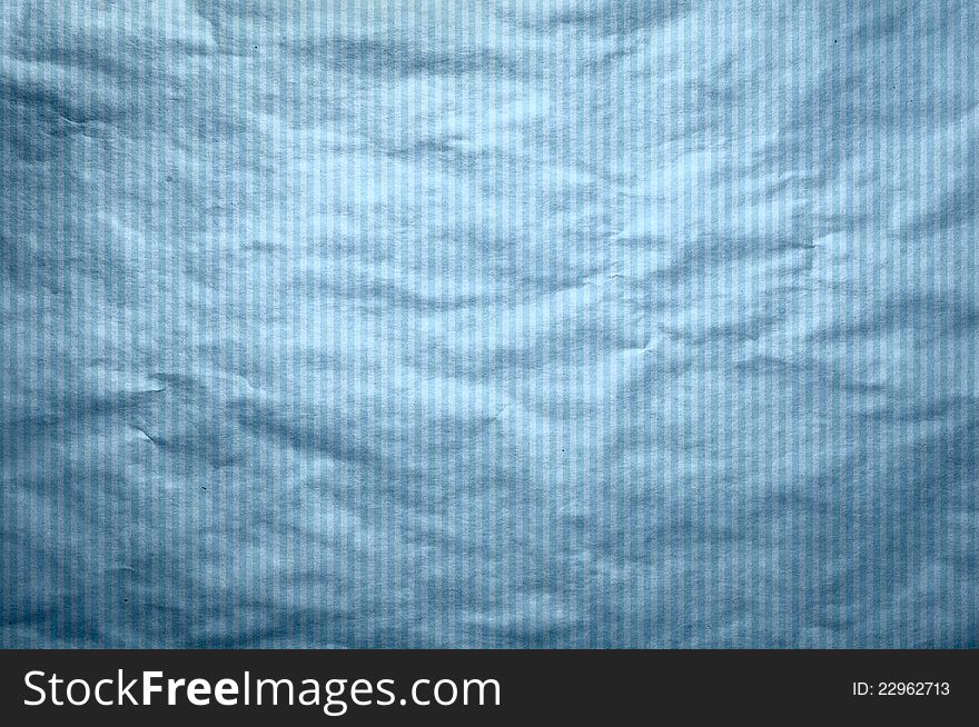 It is a texture of an old paper in a blue strip. A background in style of a retro