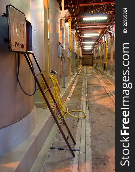 Winery Hall With Steel Wine Tanks And Ladder