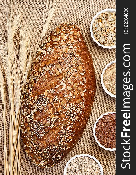 Loaf of Seeduction Whole Grain Bread with Ingredients