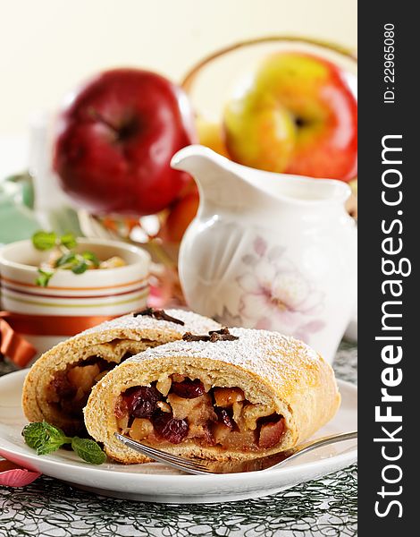 Slice of an apple strudel with fresh ingredients. Slice of an apple strudel with fresh ingredients