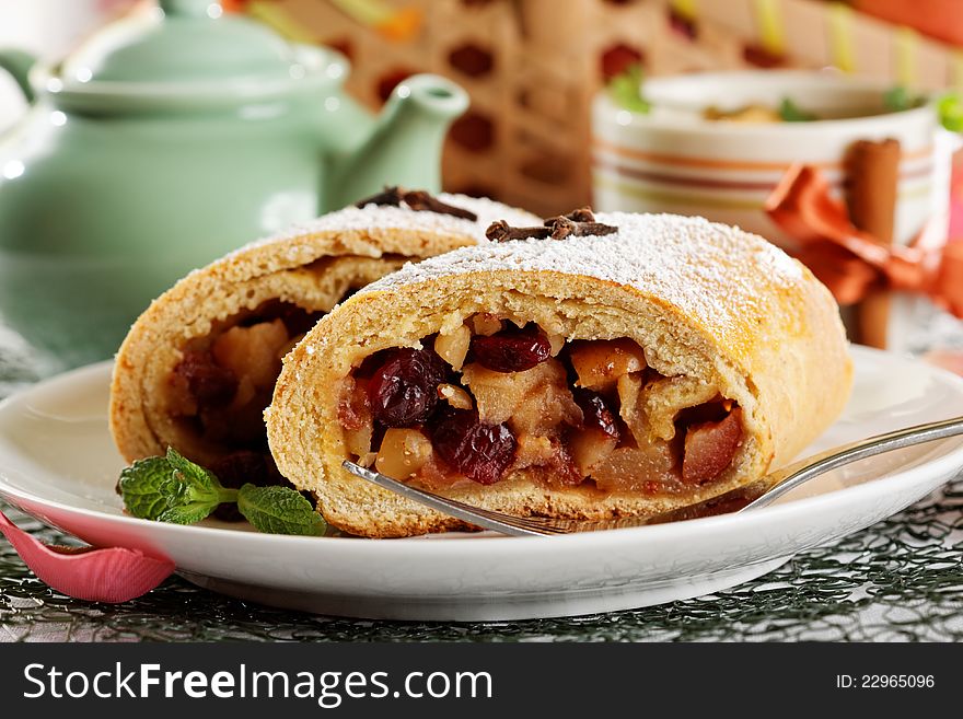 Slice of an apple strudel with fresh ingredients. Slice of an apple strudel with fresh ingredients