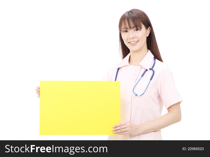 Young japanese female nurse holding a blank board