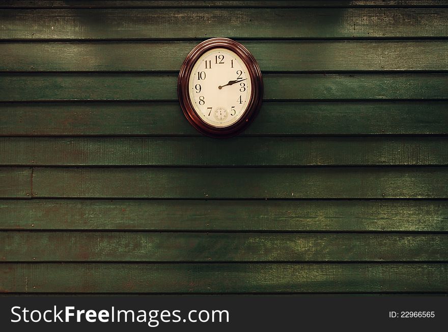 Old wooden wall with clock