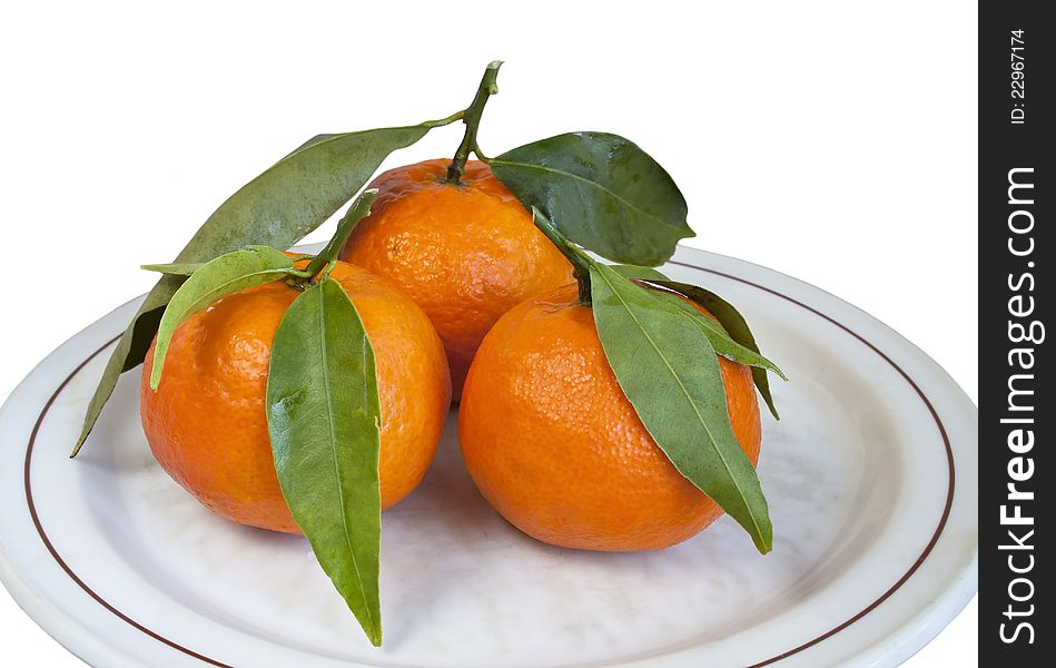 Ripe mandarins on plate in isolated on white. Ripe mandarins on plate in isolated on white