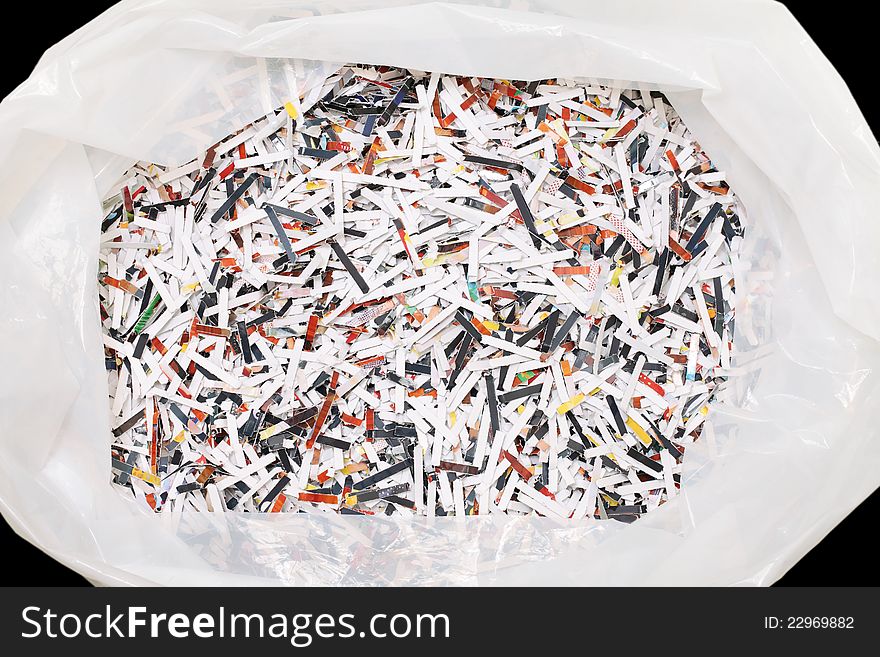 Shredded paper in plastic trash bag