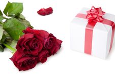 A Bouquet Of Roses And Gift On White Background. Royalty Free Stock Photos A Bouquet Of Roses And Gift On White Background. Royalty Free Stock Photos