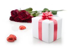 A Bouquet Of Roses And Gift On White Background. Stock Images A Bouquet Of Roses And Gift On White Background. Stock Images
