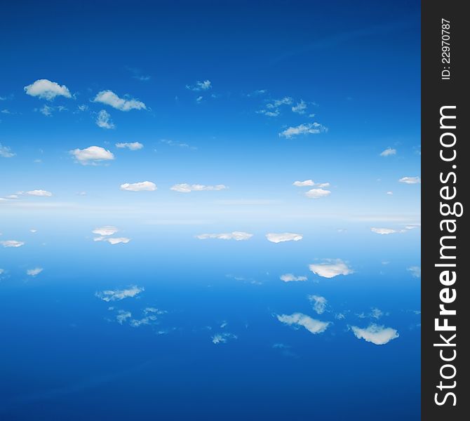 Beautiful blue sky background reflected in water. Beautiful blue sky background reflected in water