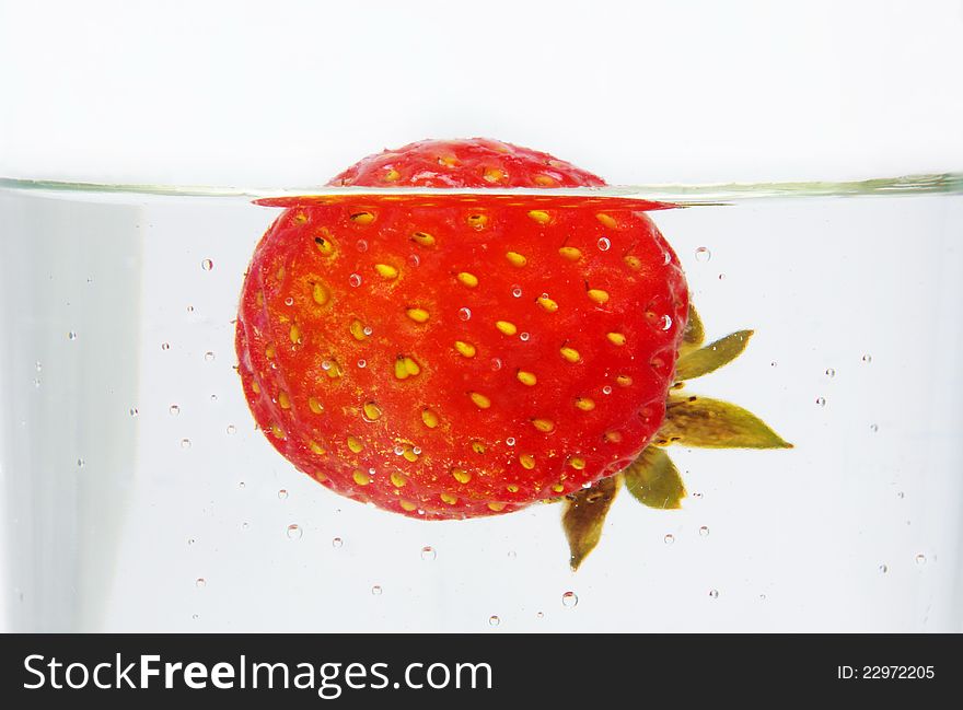 Strawberry closeup in the water. Strawberry closeup in the water