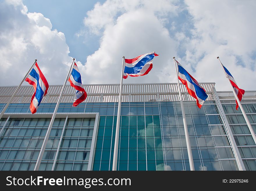 Thai national flags blowing in the wind in front of the building. Thai national flags blowing in the wind in front of the building