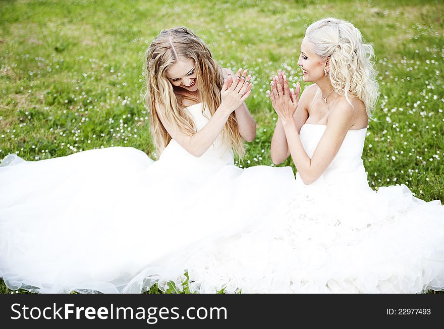 Two beautiful bride in the garden