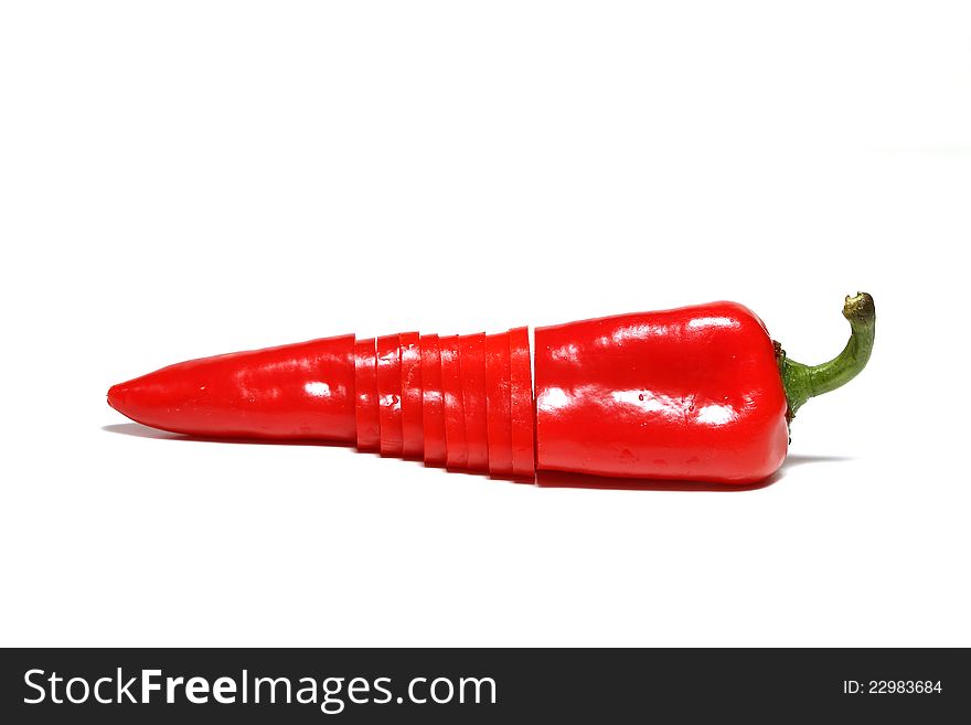 Sliced red pepper over white background