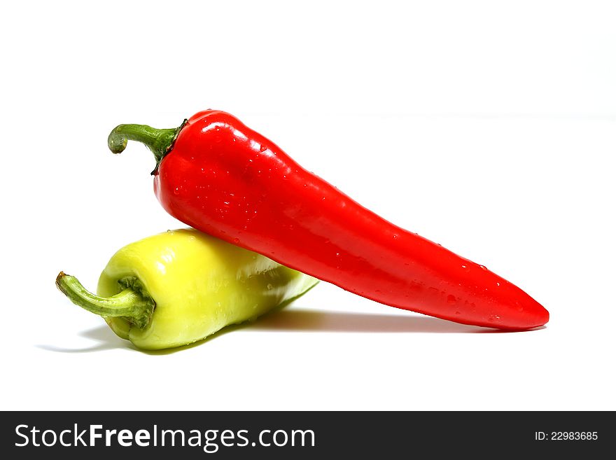 Red and green peppers isolated over white background