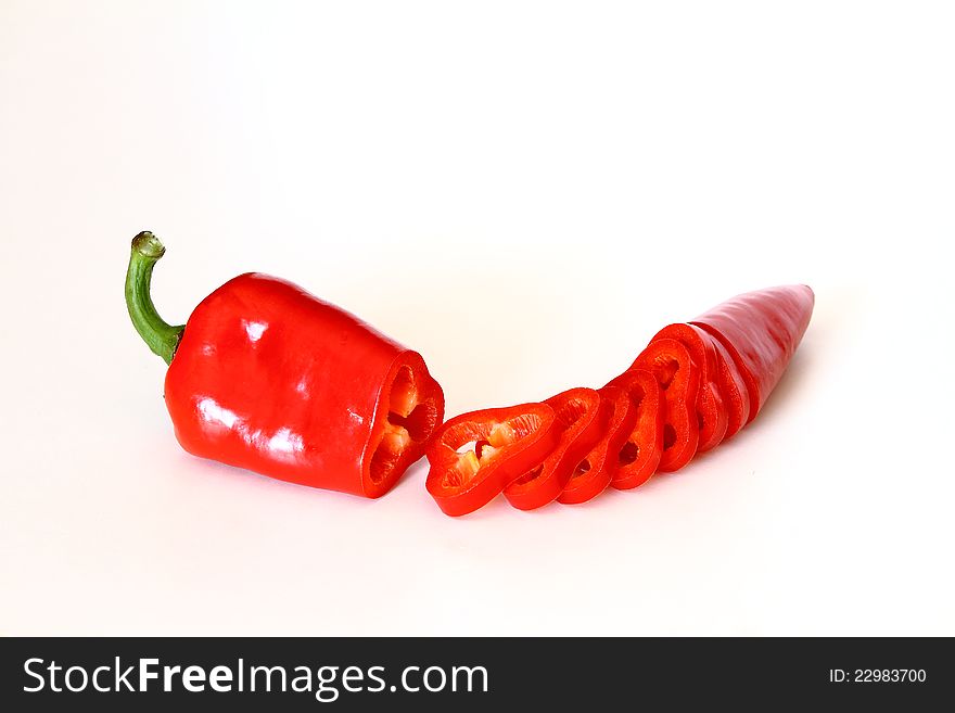 Sliced red pepper over white background