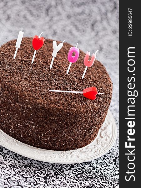 Chocolate cake with candles, selective focus