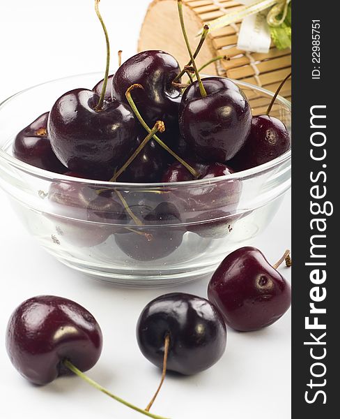 Ripe fresh cherry in the glass bowl