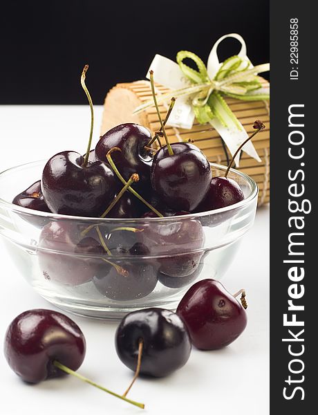 Ripe fresh cherry in the glass bowl