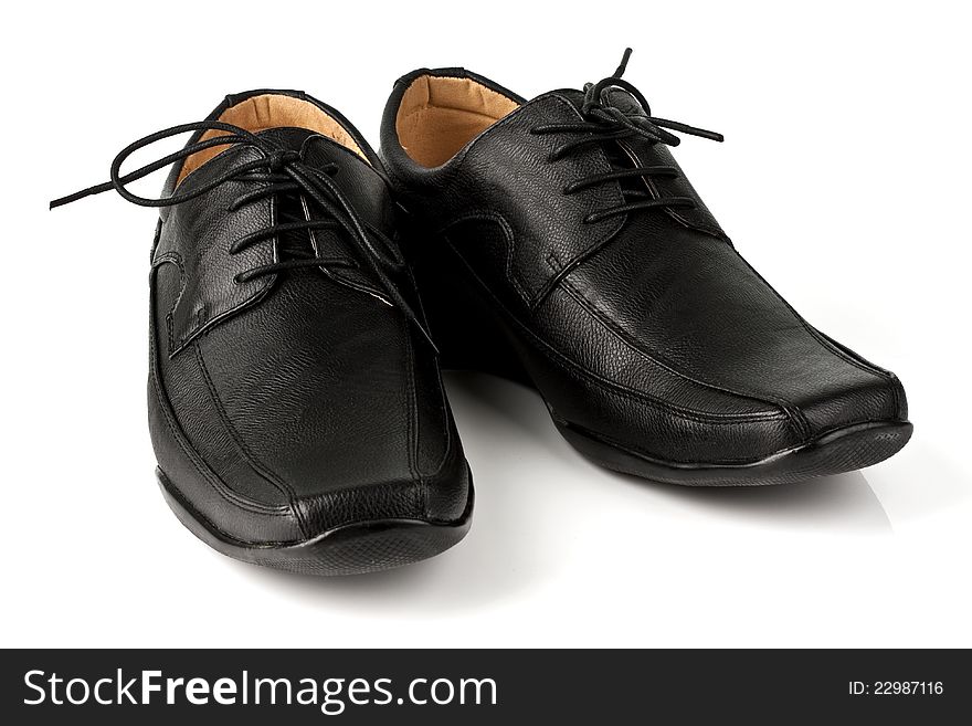 Elegant black leather men's shoes on white background with shadow. Elegant black leather men's shoes on white background with shadow.