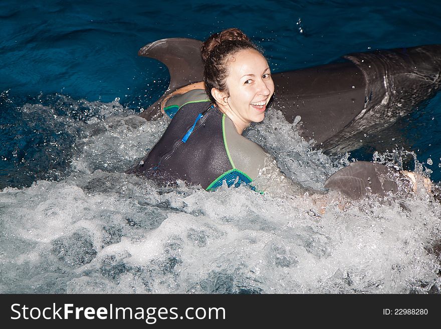 Happy girl and dolphin