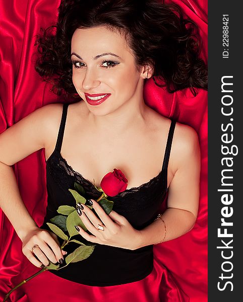 Beautiful brunette and red rose. Beautiful brunette and red rose