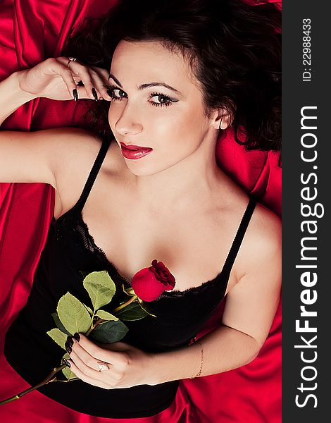 Beautiful brunette and red rose. Beautiful brunette and red rose