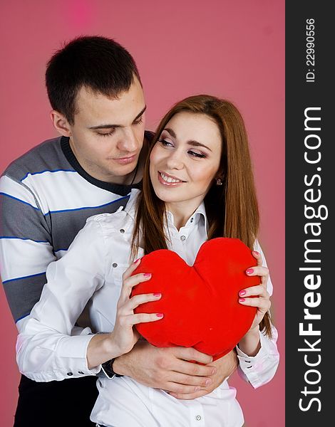 Young couple with red heart