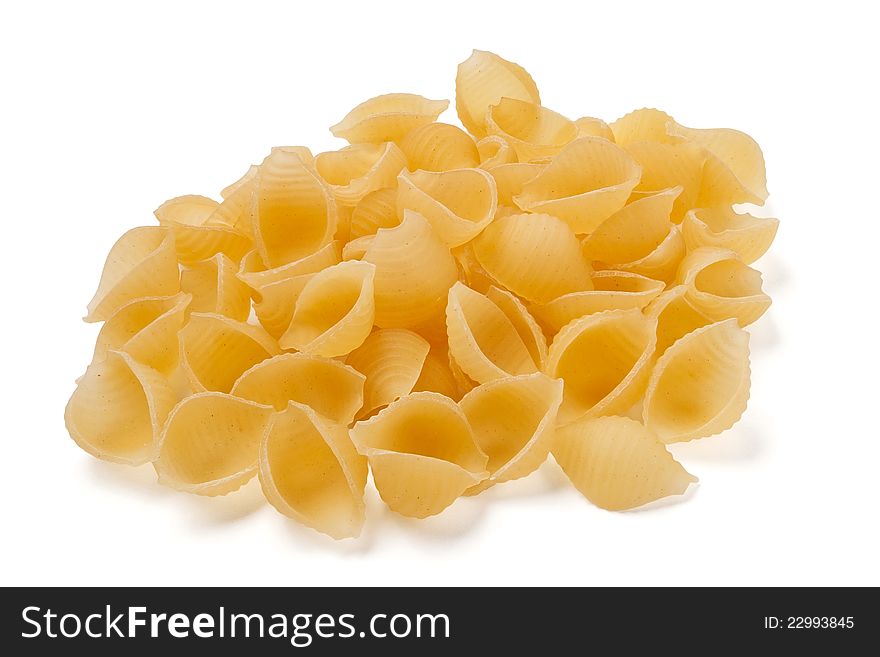 Shell-shaped pasta against white background