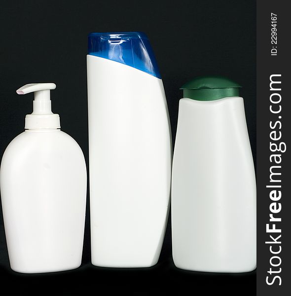 Three white plastic bottles
