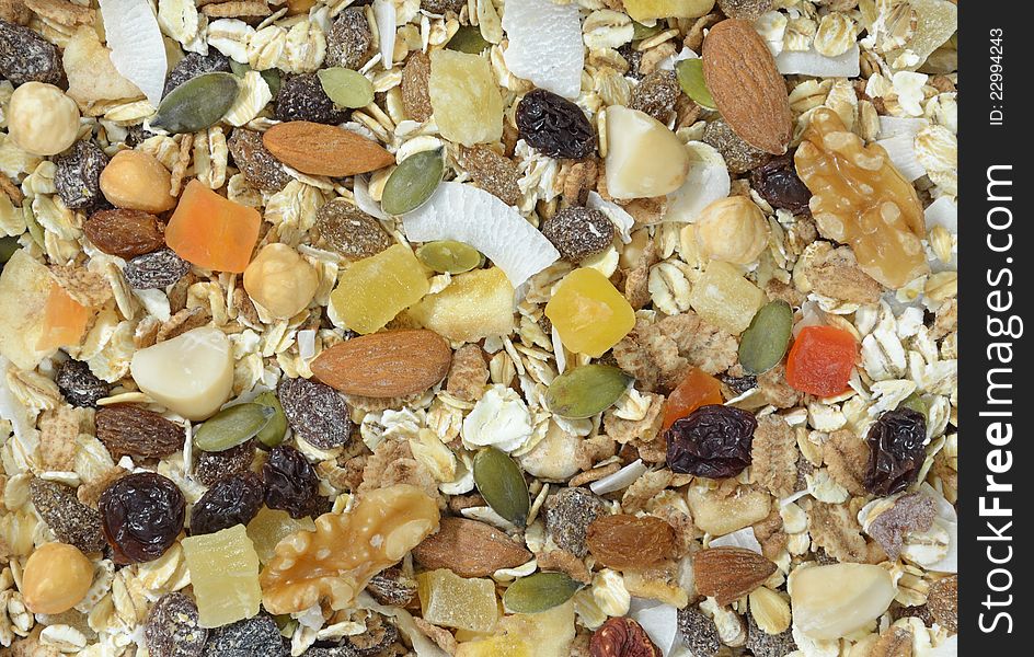 Muesli background with nuts, seed grains and fruit