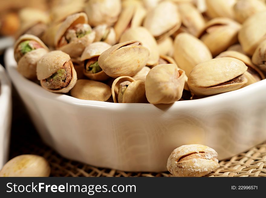 Pistachios in a white saucer