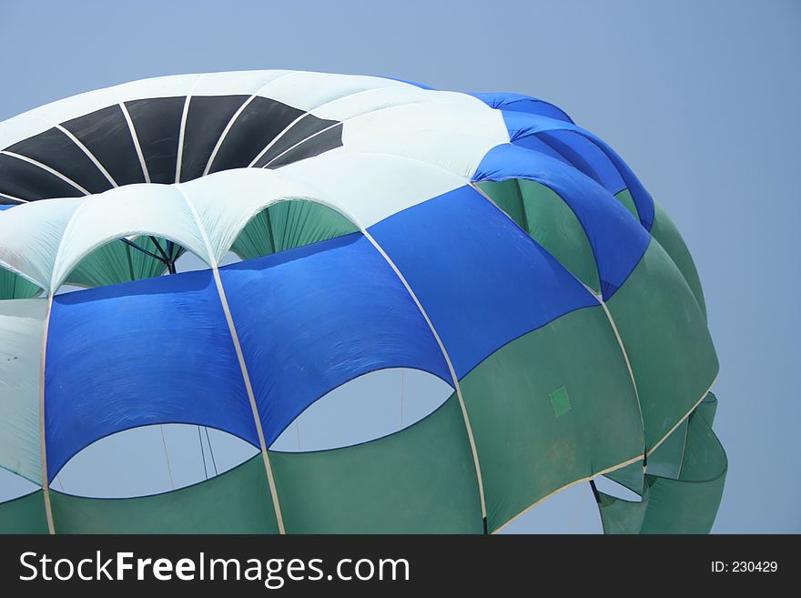 A parachute fills in the breeze. A parachute fills in the breeze