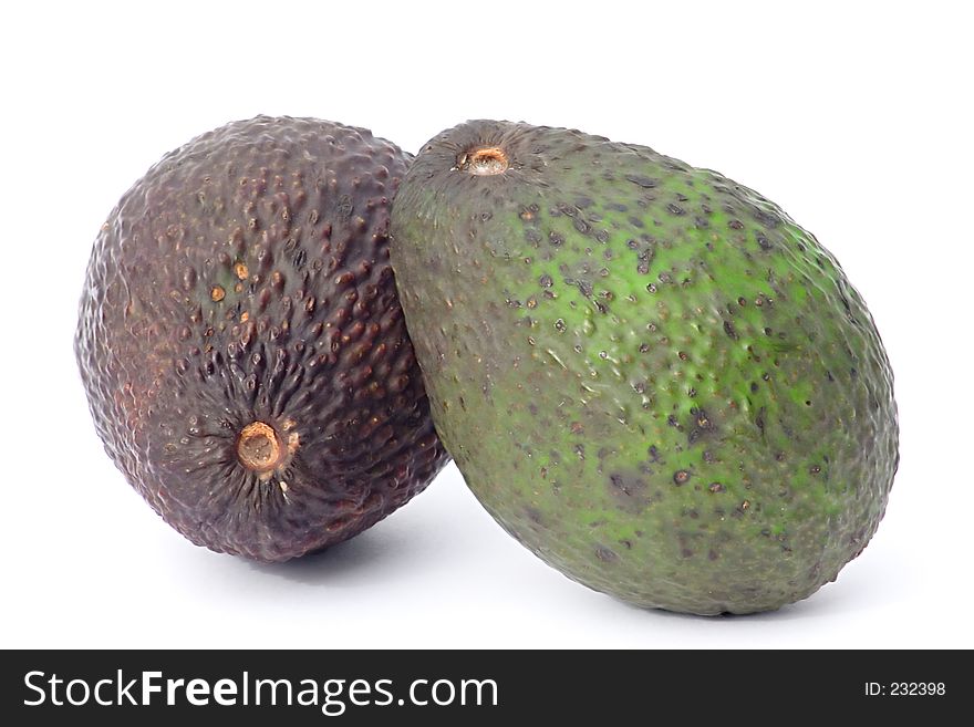 Pair of avocados, one ripe one unripe, isolated on white background