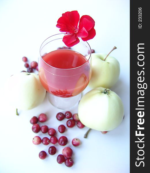 Red drink with autumn gifts