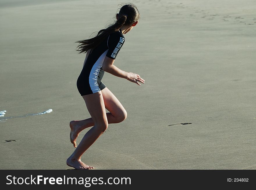 Young girl on beach playing. Young girl on beach playing