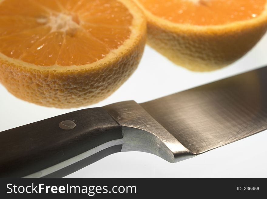 Closeup of sliced orange and knife