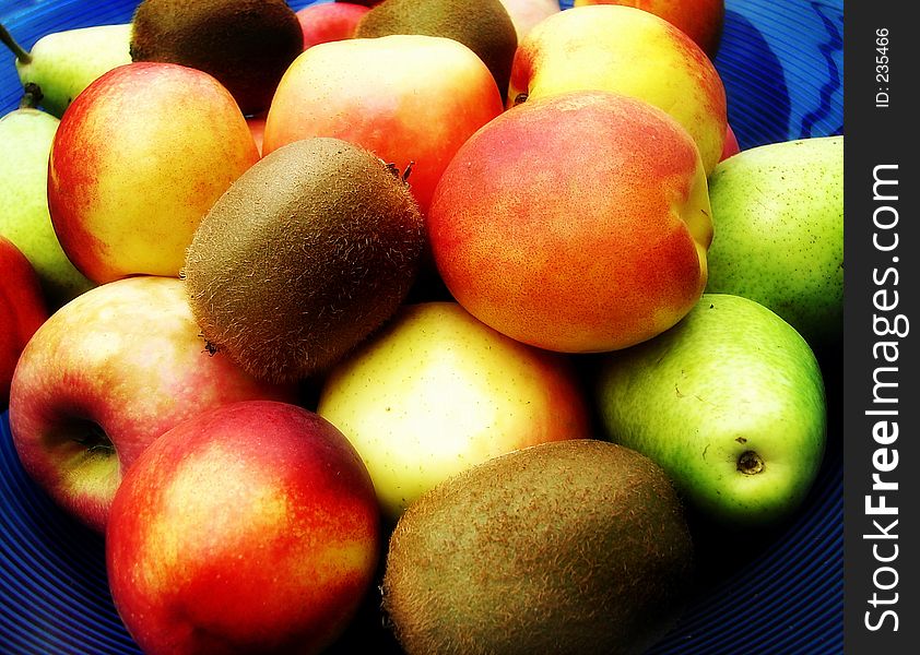 Apples,pears and kiwis in a bowl. Apples,pears and kiwis in a bowl