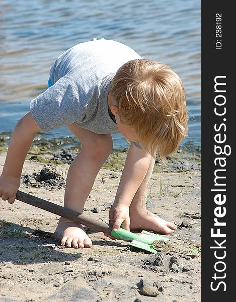 Boy playing at the beach