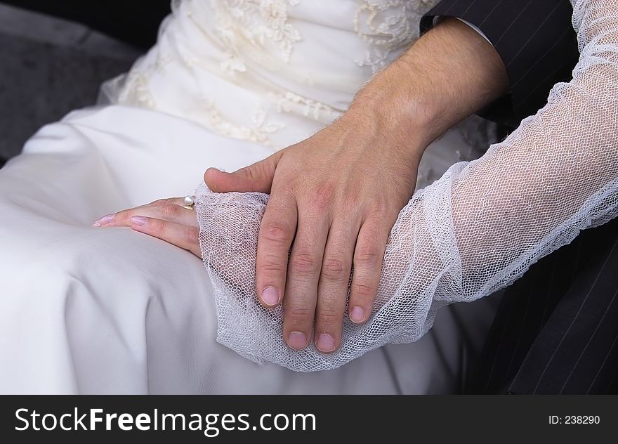 Hands of a new married couple. Hands of a new married couple