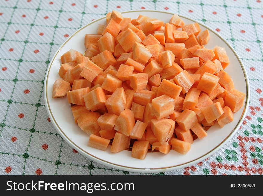Slices of carrots on a white plate. Slices of carrots on a white plate