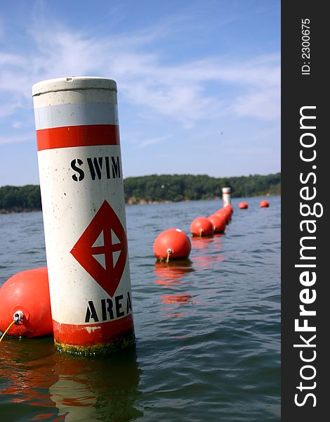 A single buoy swim area marker. A great shot for summer saftey or for a concept of danger. A single buoy swim area marker. A great shot for summer saftey or for a concept of danger.