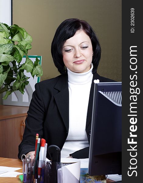 Portrait of a businesswoman when working. Shot in office. Portrait of a businesswoman when working. Shot in office.