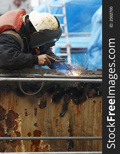 One welder working on steel project. One welder working on steel project