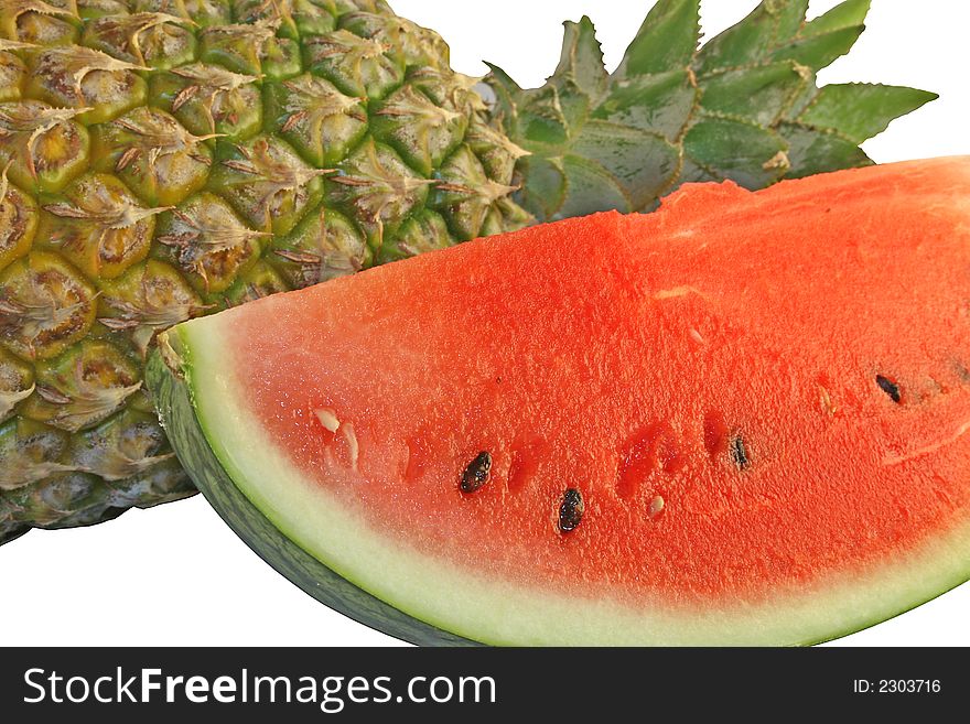 Pineapple and sliced water melon on a white background. Pineapple and sliced water melon on a white background