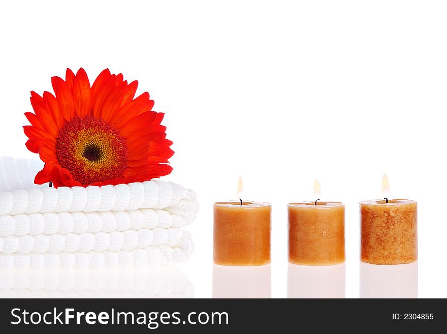 Candles, flower, and white towels. Candles, flower, and white towels