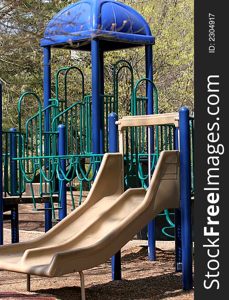 Bright blue playground equipment in a park