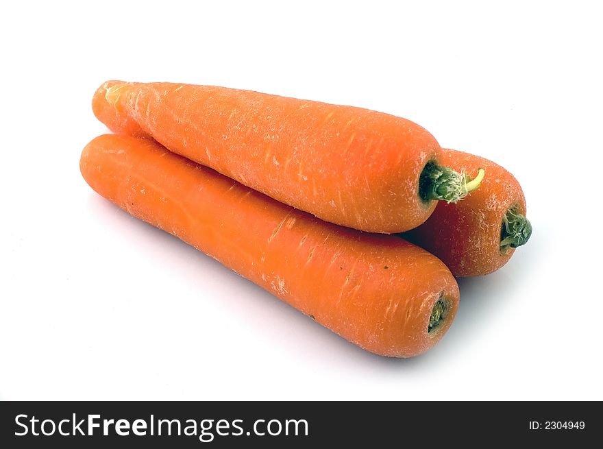 Carrots stacked together over white background. Carrots stacked together over white background