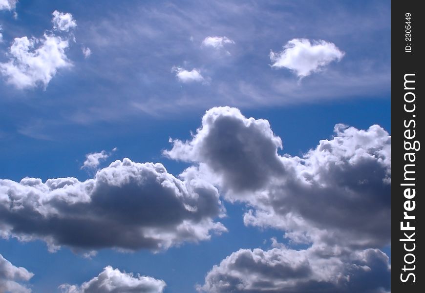 White clouds in blue sky on sunny day